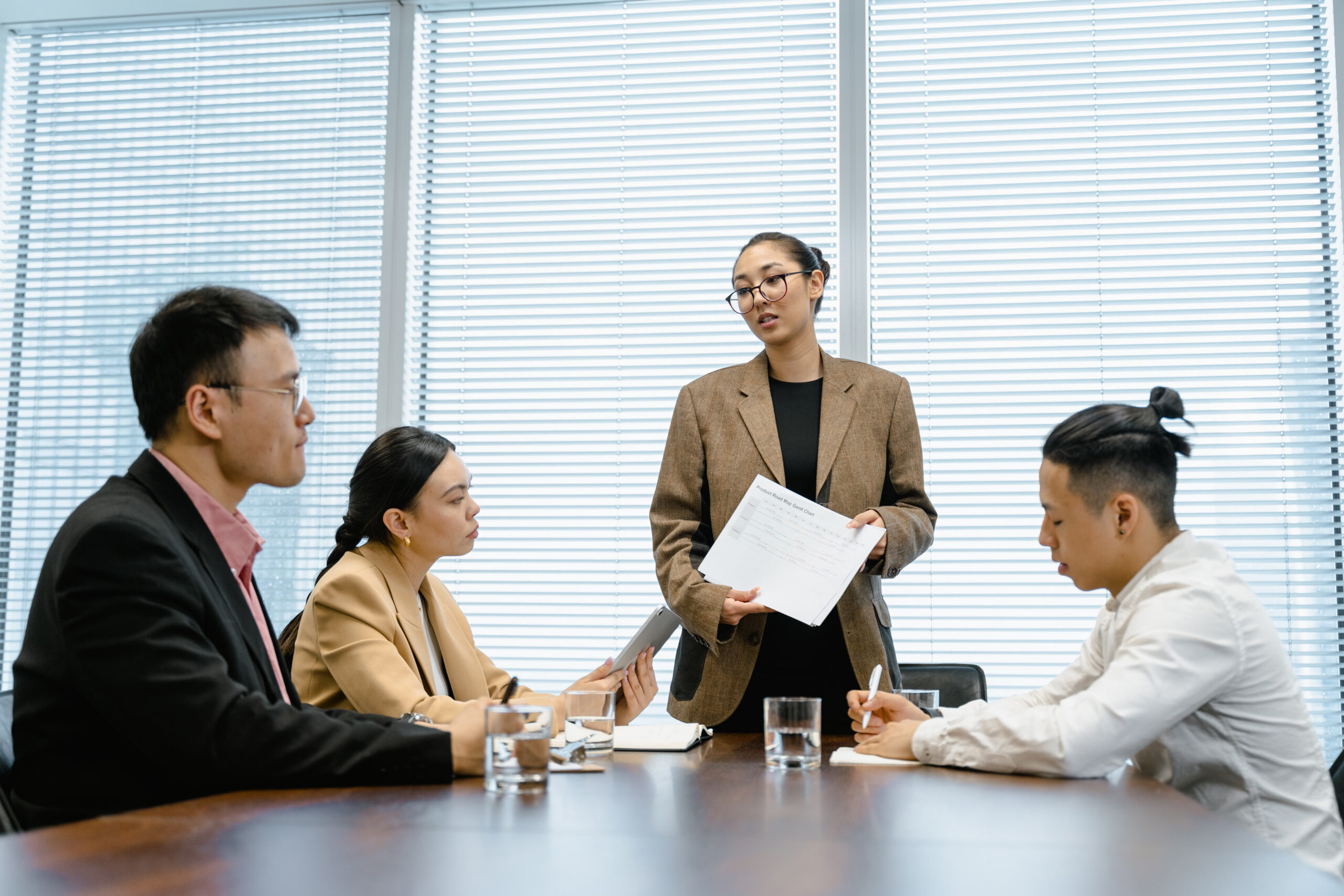 A team leader guiding colleagues through a workplace discussion.